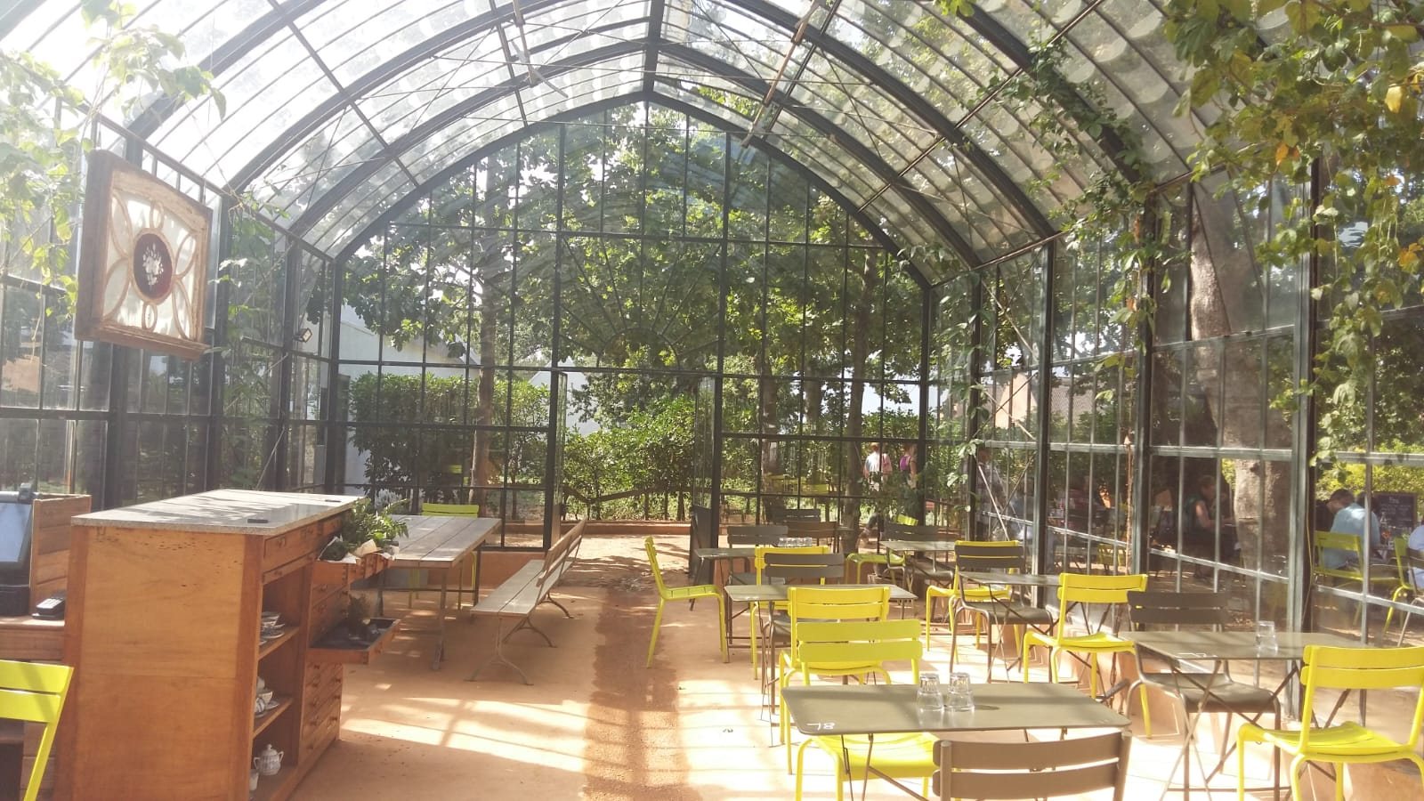 The glasshouse Greenhouse restaurant with yellow chairs at Babylonstoren