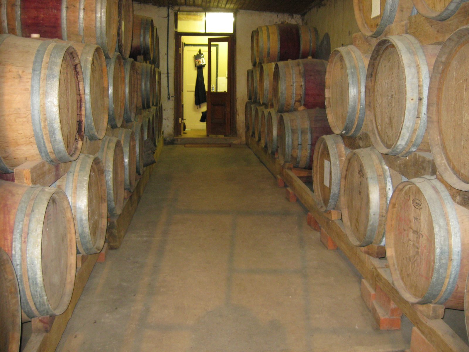 Rows of oak barrels in the historic Muratie cellar near Stellenbosch
