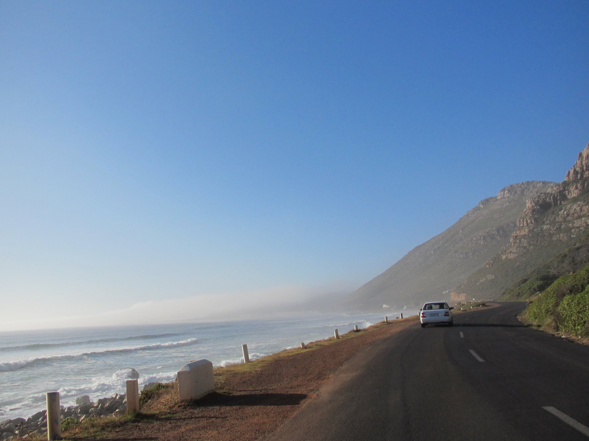 The coastal road past Misty Cliffs with sea mist rolling in off the Atlantic