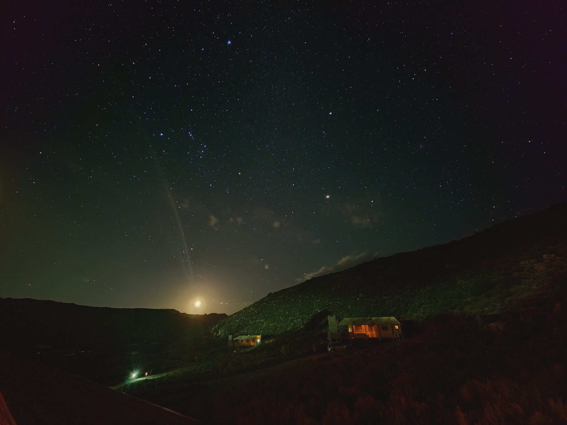 Star-filled night sky over the Karoo hills at Aquila