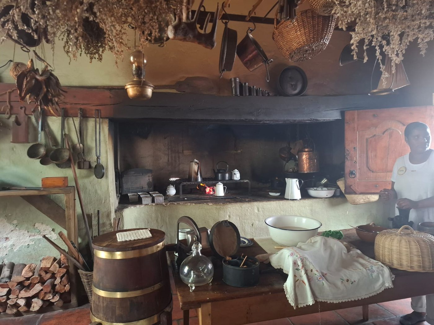 An old farm kitchen with hearth and hanging dried goods at Soetmelksvlei